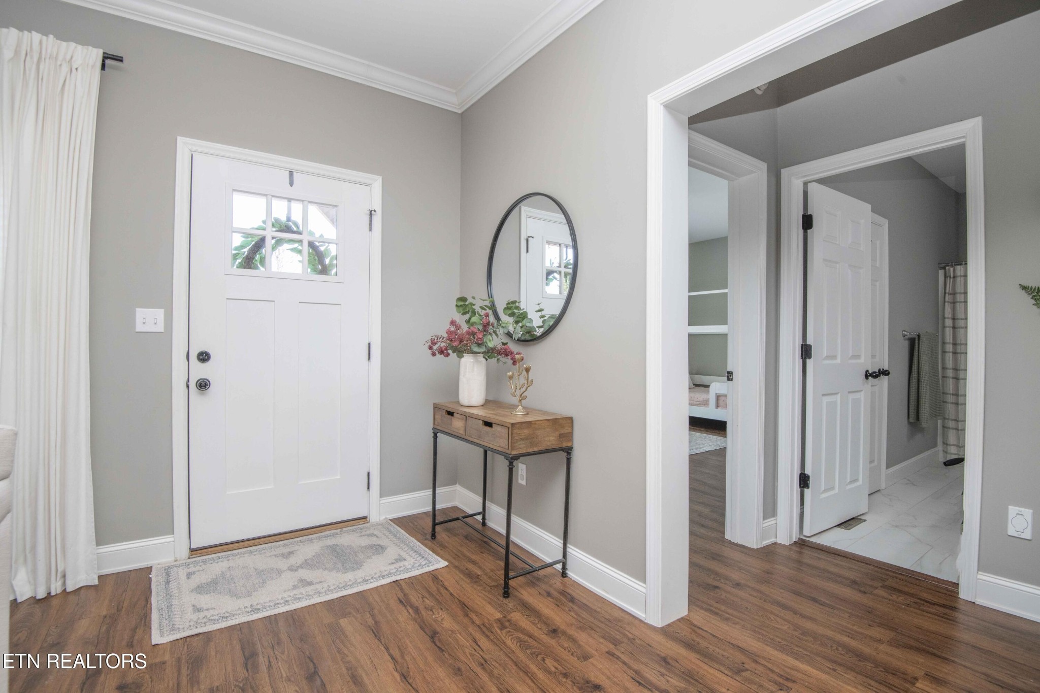 1562 Pullen Road Sevierville, TN 37862 - Photo 8 of 53 a view of a livingroom with wooden floor and a potted plant