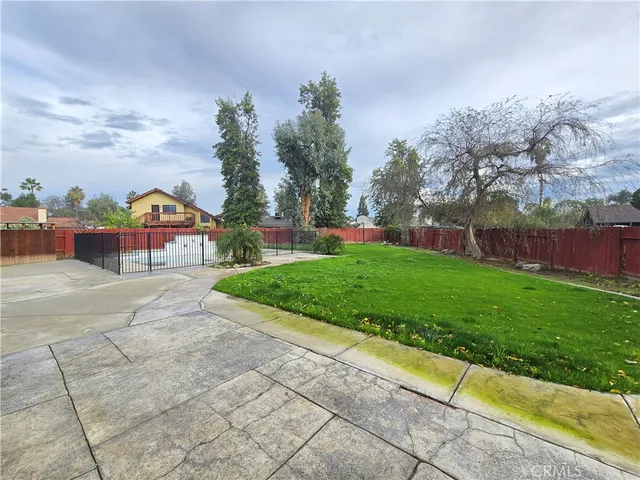 a view of a street with a houses in the background