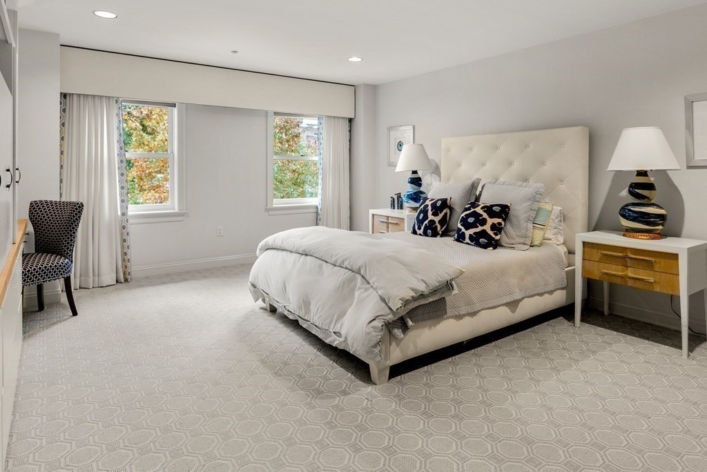1160 Beacon Street, Unit 301 Brookline, MA 02446 - Photo 10 of 18 a bedroom with a bed and a chair