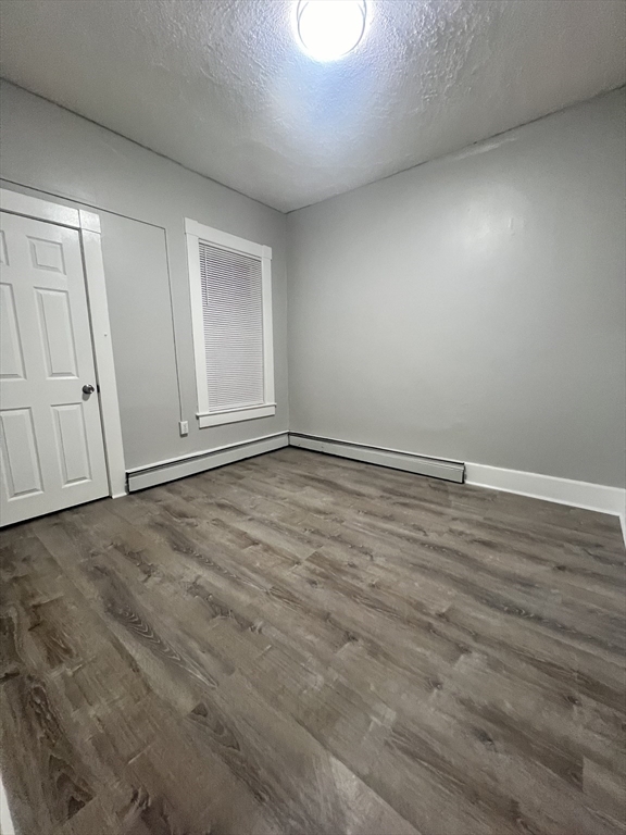 136-142 Bailey Street, Unit 2 Lawrence, MA 01843 - Photo 3 of 13 wooden floor in an empty room