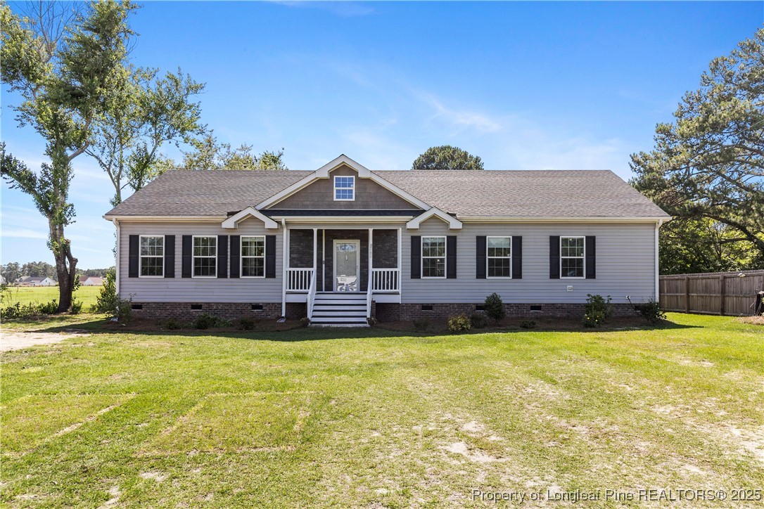 a front view of a house with swimming pool having outdoor seating
