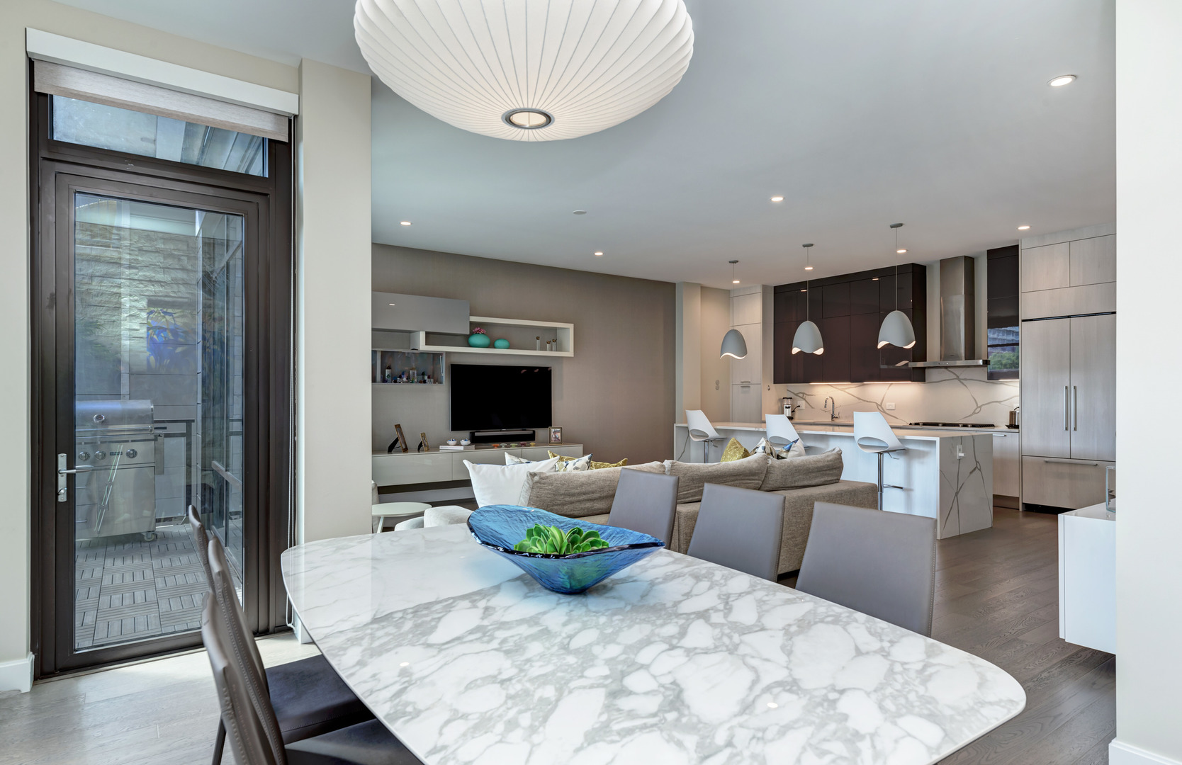 28 North Carpenter Street, Unit 3S Chicago, IL 60607 - Photo 13 of 37 a living room with furniture a flat screen tv and a large window