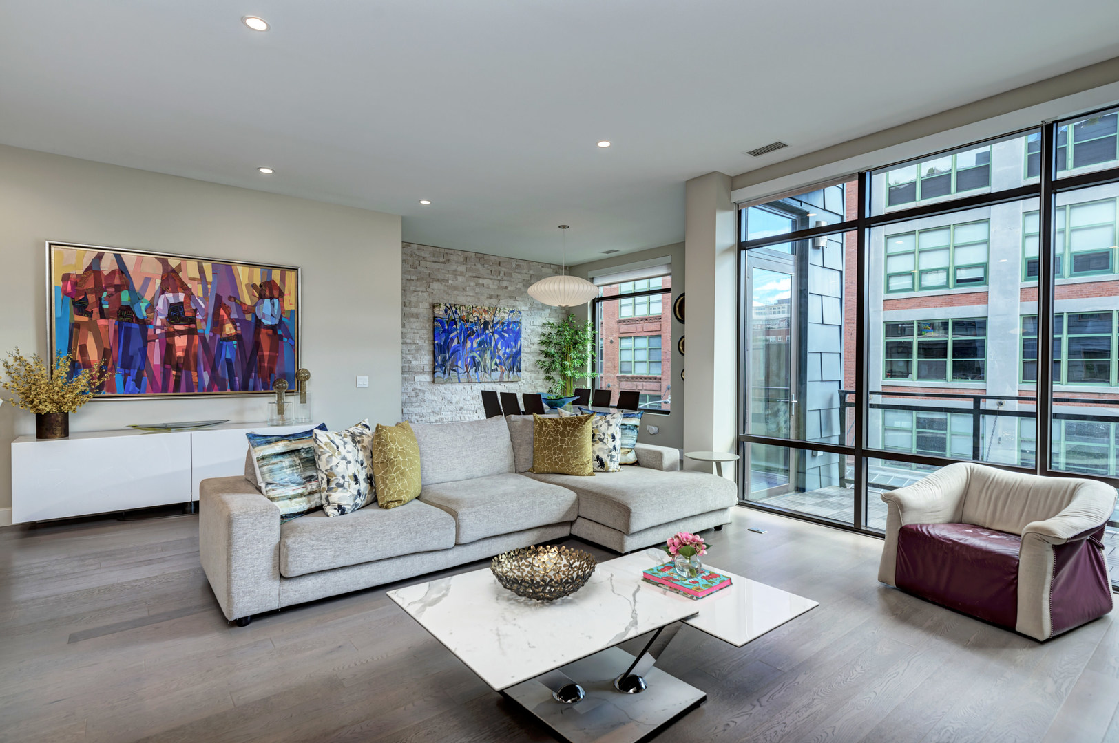 28 North Carpenter Street, Unit 3S Chicago, IL 60607 - Photo 16 of 37 a living room with furniture and a large window