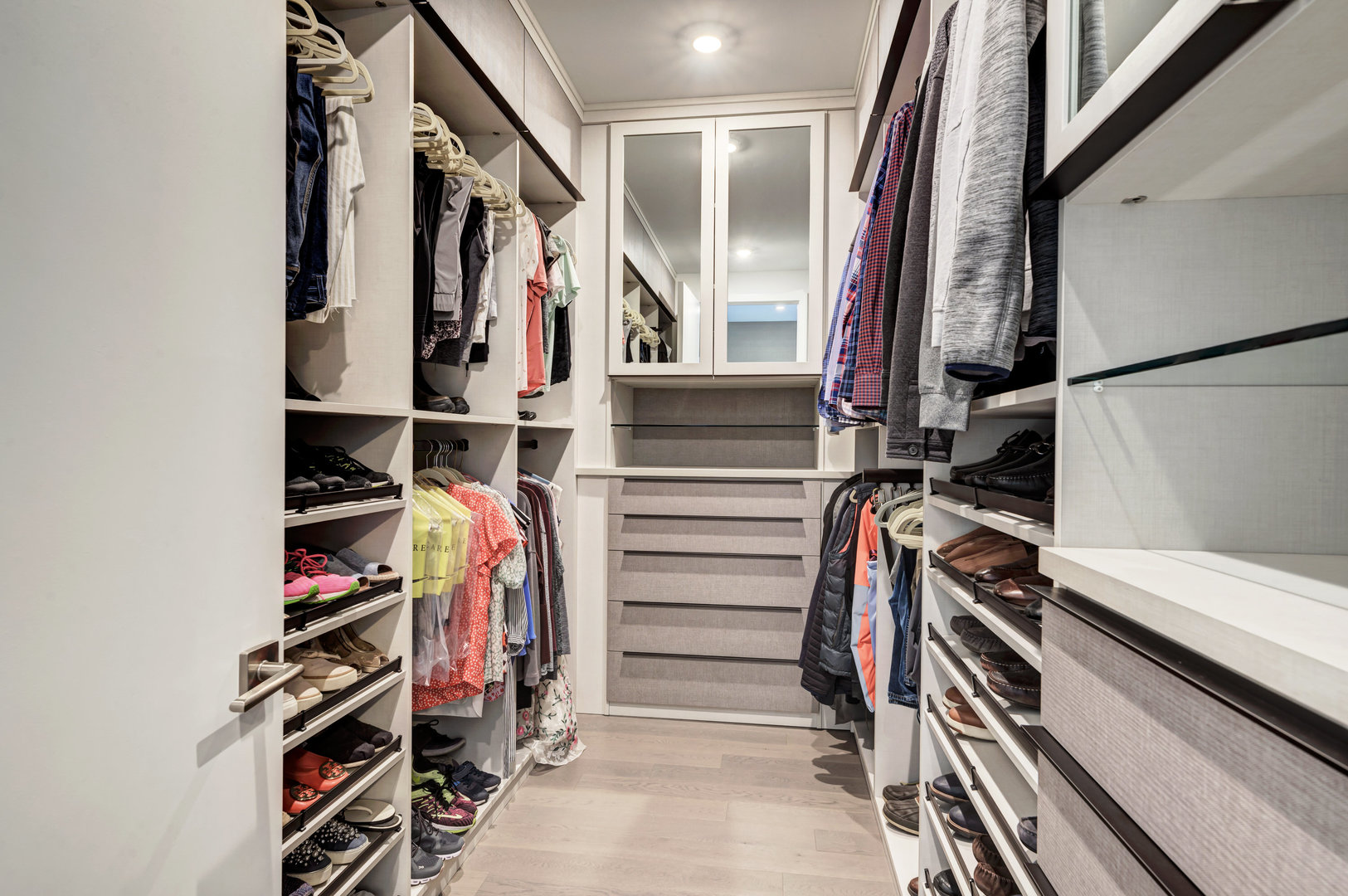 28 North Carpenter Street, Unit 3S Chicago, IL 60607 - Photo 25 of 37 a view of walk in closet with clothes and shoes