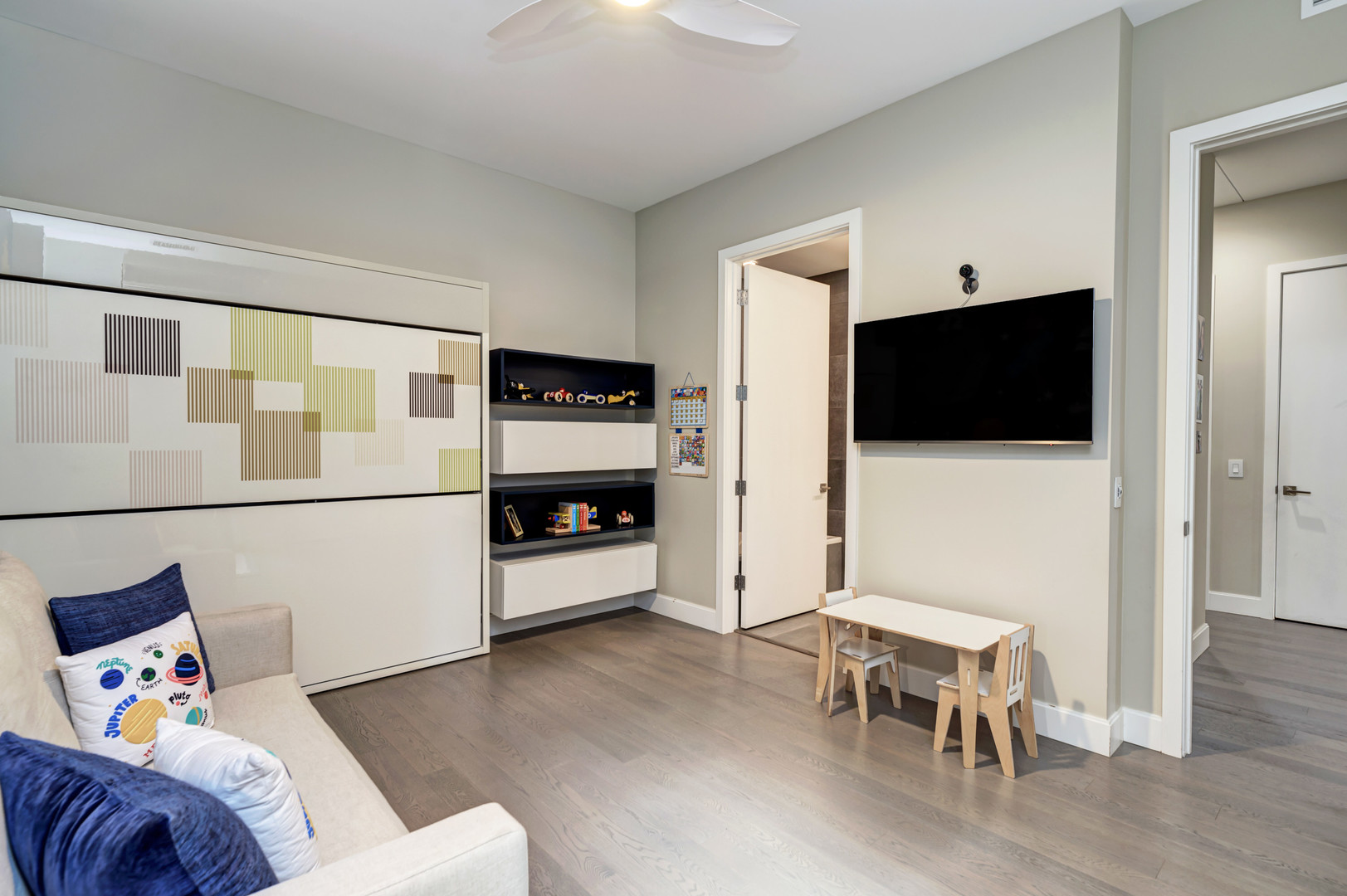 28 North Carpenter Street, Unit 3S Chicago, IL 60607 - Photo 29 of 37 a living room with furniture and a flat screen tv