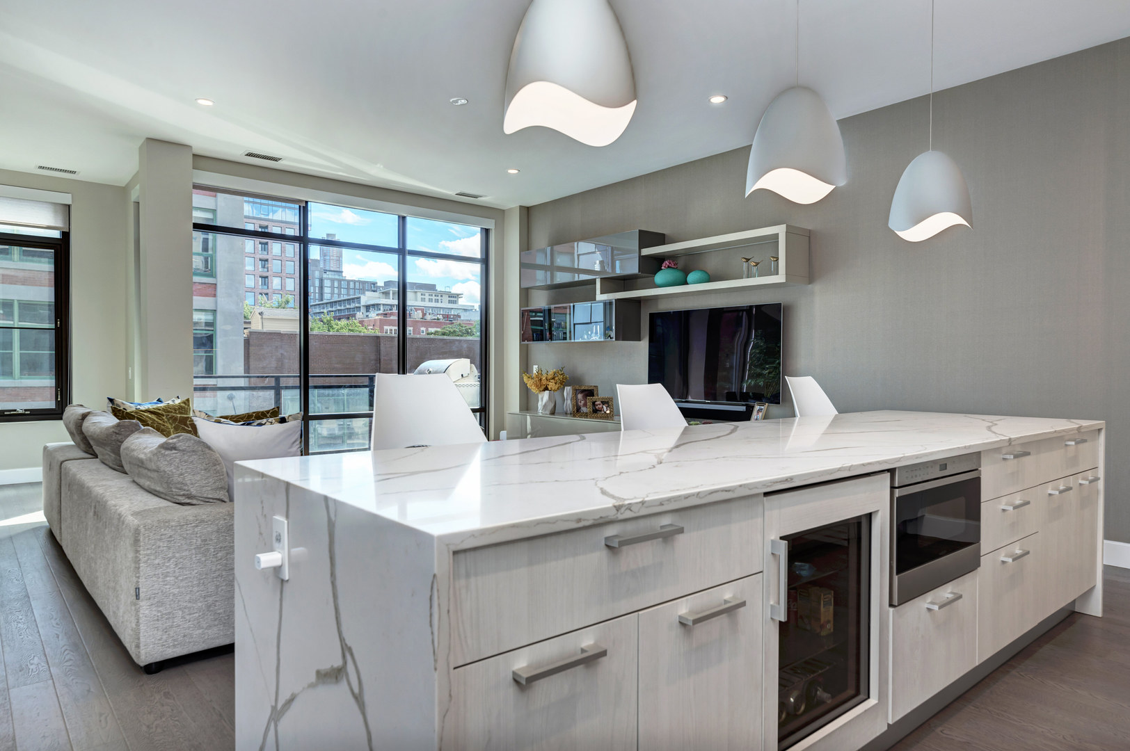 28 North Carpenter Street, Unit 3S Chicago, IL 60607 - Photo 4 of 37 a kitchen with a stove and a chandelier