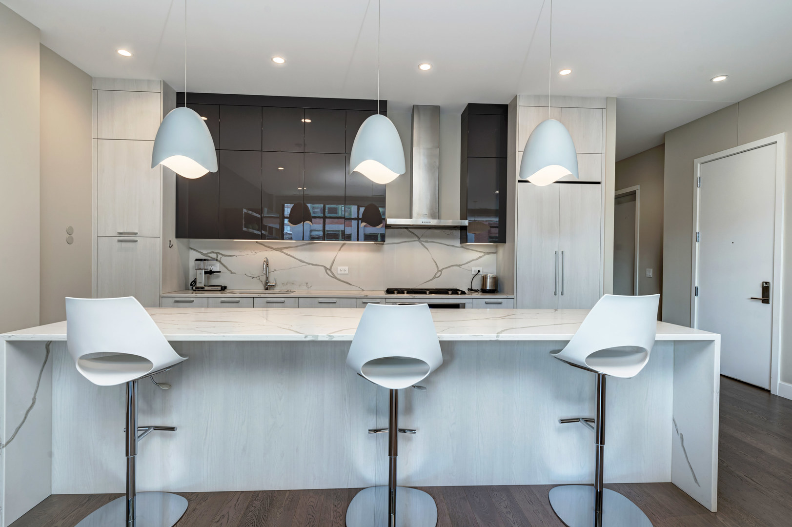 28 North Carpenter Street, Unit 3S Chicago, IL 60607 - Photo 6 of 37 a kitchen with kitchen island stainless steel appliances a sink and cabinets