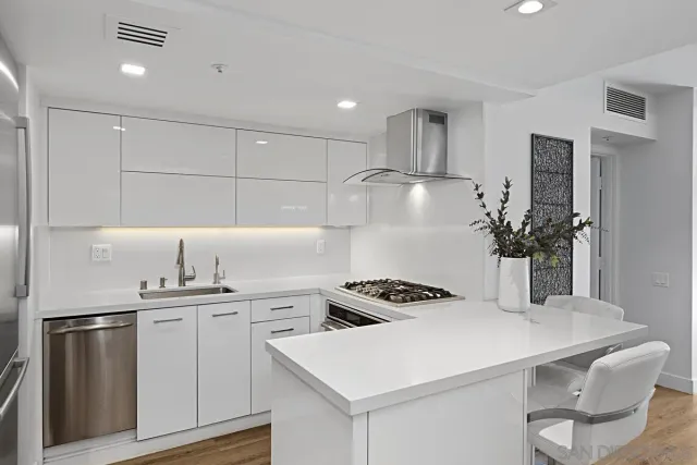 a kitchen with a refrigerator and sink