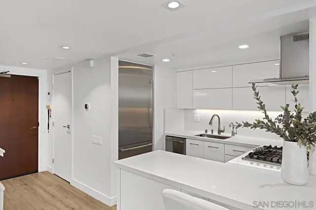 a bedroom with a bed and a workspace