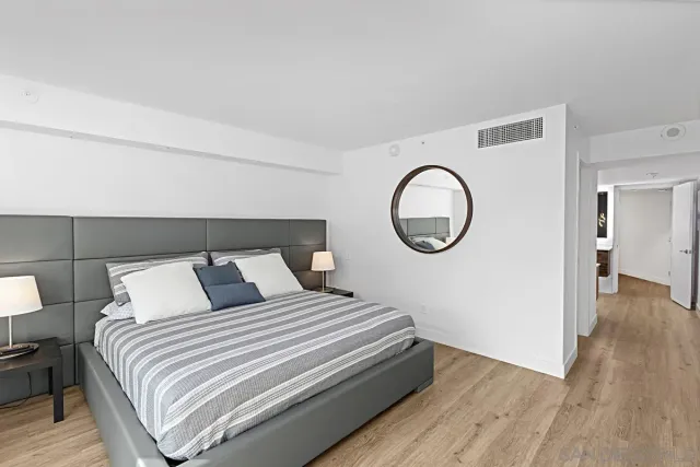 a spacious bathroom with a sink and a mirror