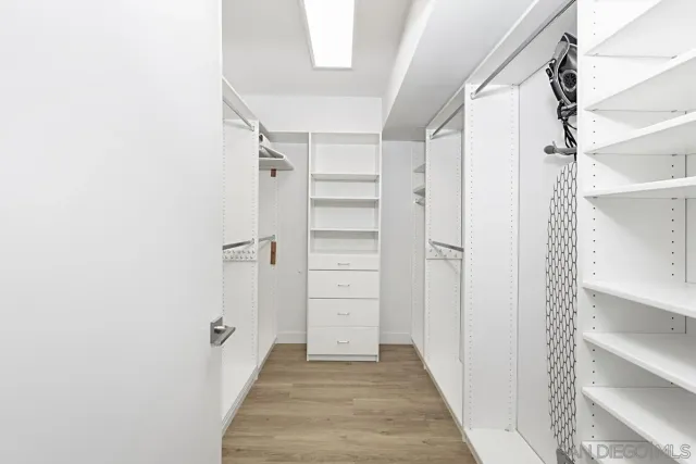 a bathroom with a sink a mirror and a toilet