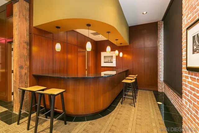 a kitchen with stainless steel appliances granite countertop a stove microwave and cabinets