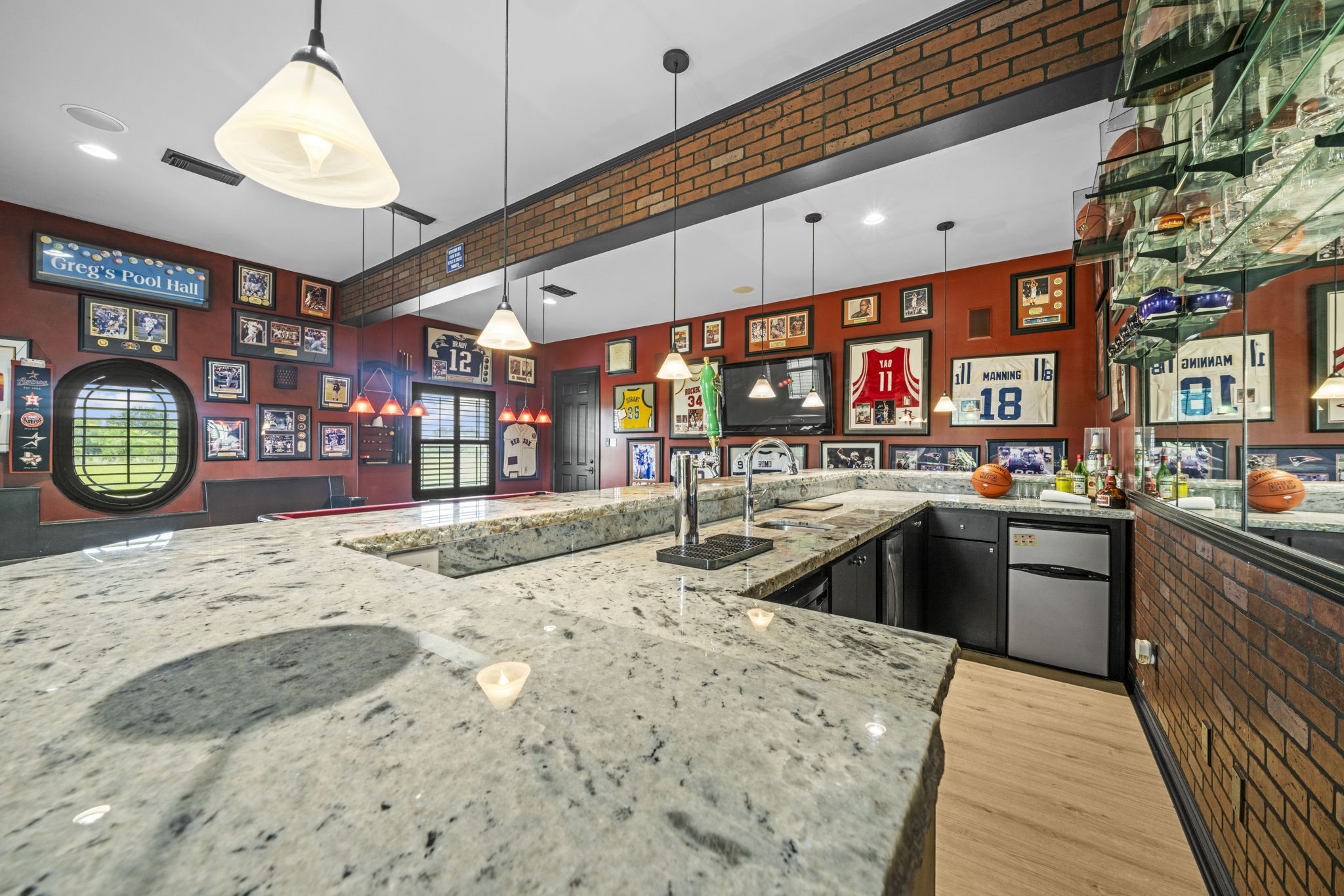 18732 Kz Road Cypress, TX 77433 - Photo 21 of 49 Bring the upscale pub experience home, featuring a sink, built-in fridge, and your own draft tower, this game room bar has absolutely everything.