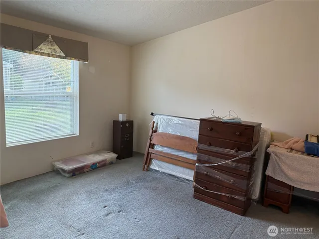 a view of hallway with walk in closet