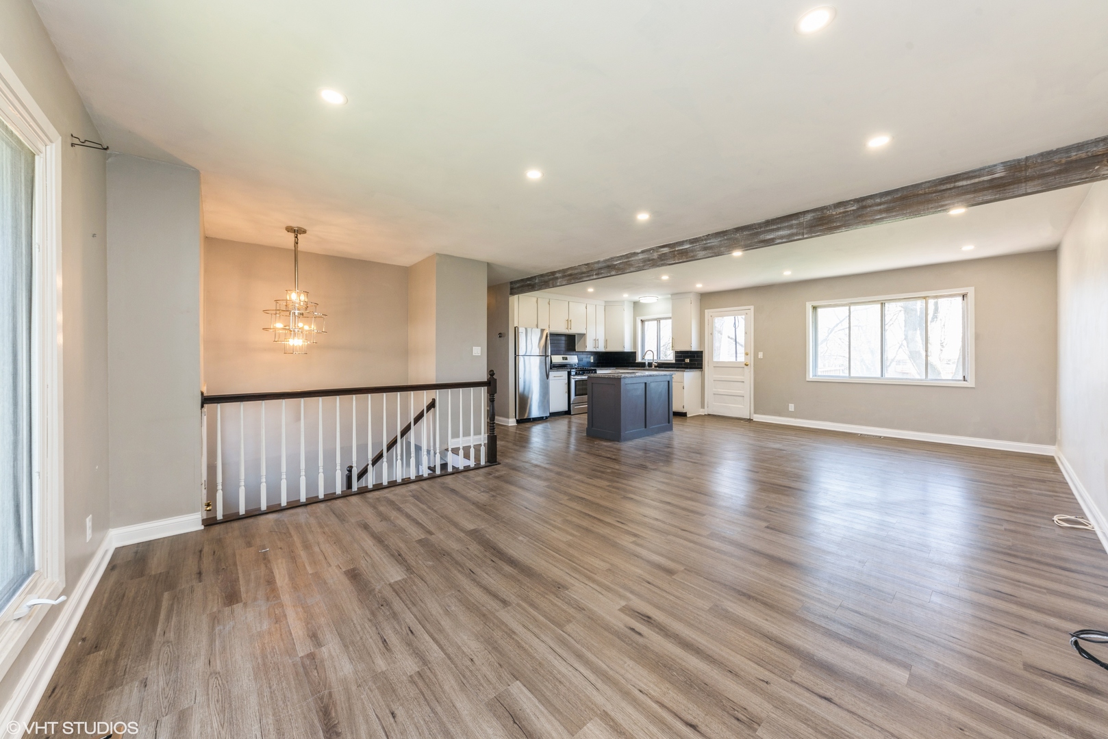 501 Ridge Circle Streamwood, IL 60107 - Photo 3 of 15 a view of an empty room with wooden floor and windows