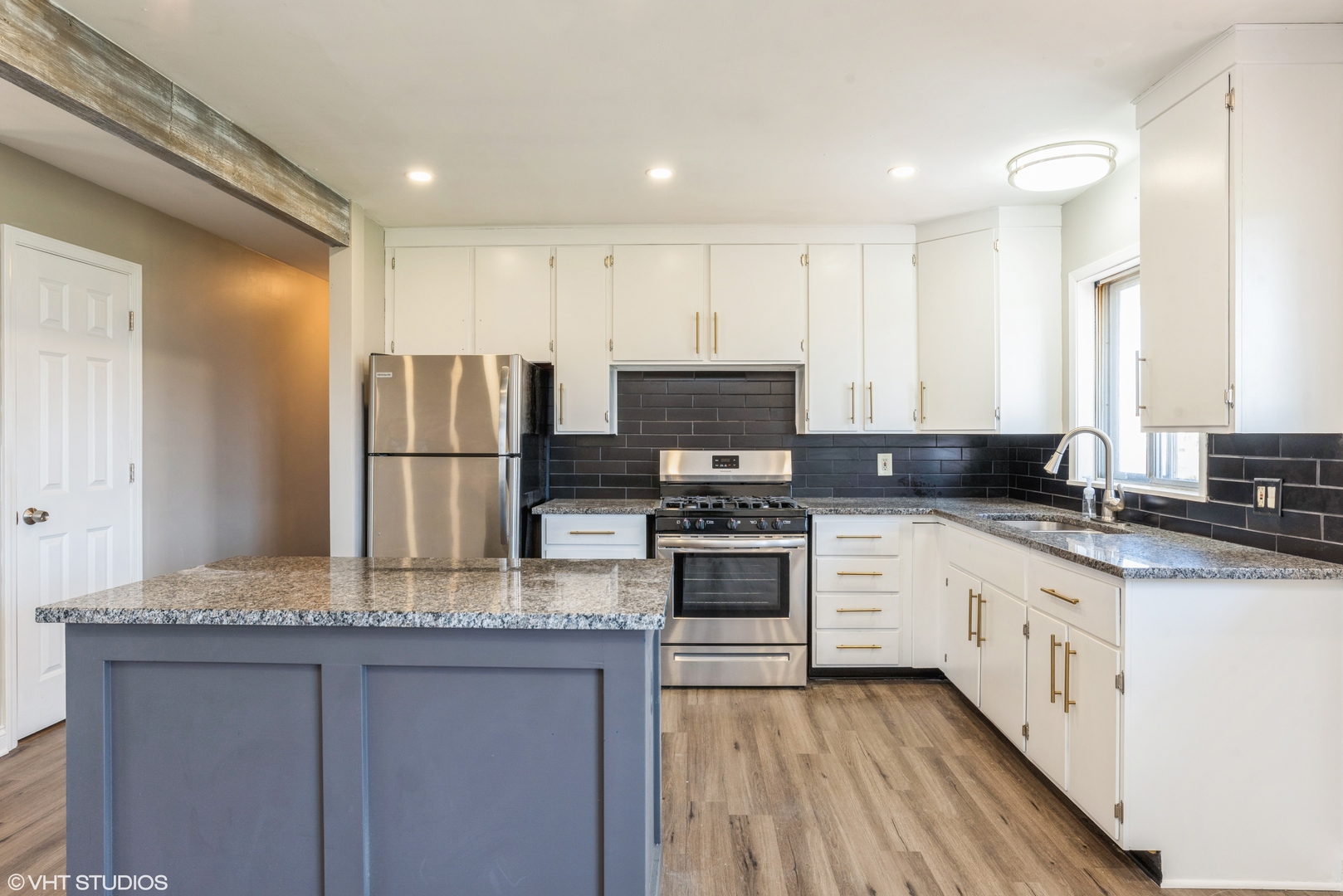 501 Ridge Circle Streamwood, IL 60107 - Photo 4 of 15 a kitchen with granite countertop a refrigerator stove top oven and sink