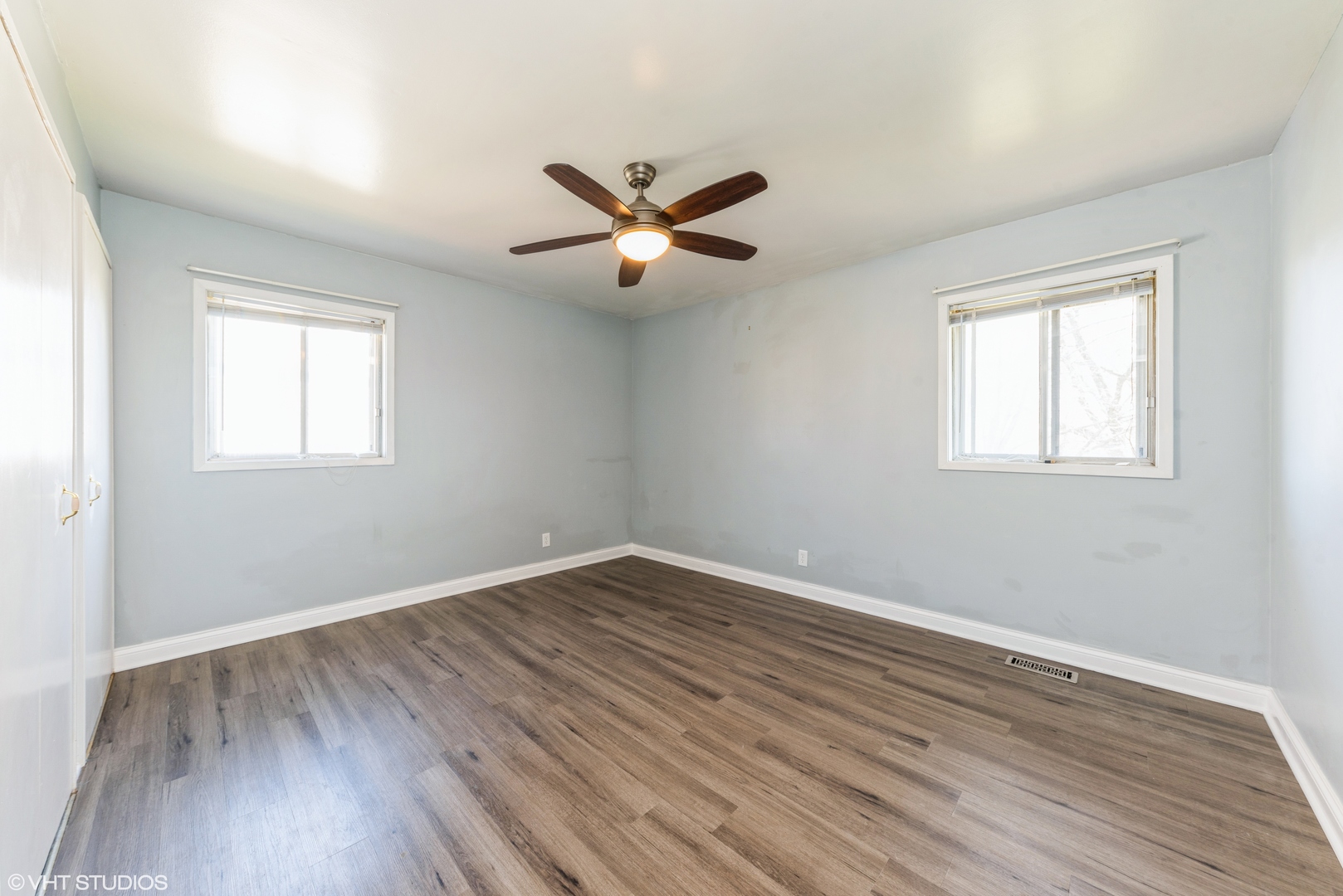 501 Ridge Circle Streamwood, IL 60107 - Photo 7 of 15 a view of a room with wooden floor and a ceiling fan