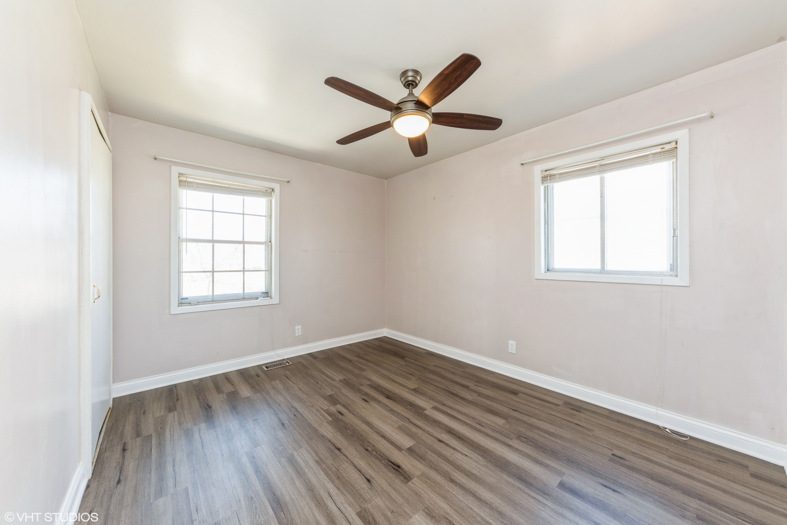 501 Ridge Circle Streamwood, IL 60107 - Photo 8 of 15 a view of empty room with wooden floor and fan