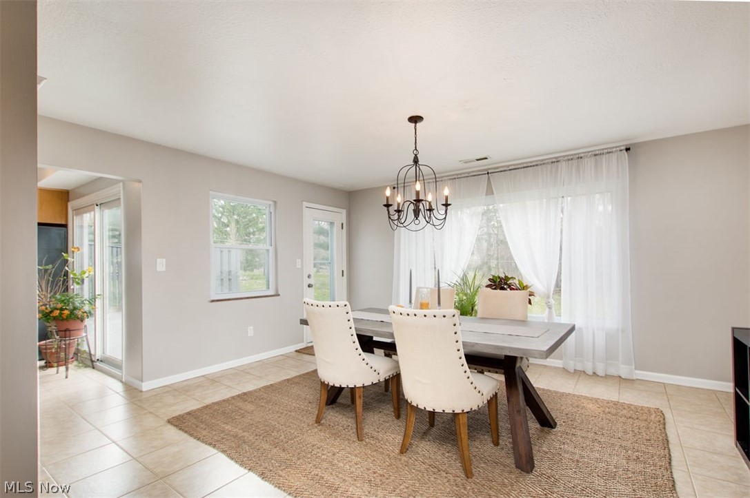 5224 Ridgebury Boulevard Cleveland, OH 44124 - Photo 6 of 21 This fabulous spacious dining room is open to the kitchen and living room and looks out onto the back yard. It has tiles floors for easy clean-up and a door to the back yard