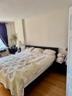 a bed sitting in a bedroom and dressers