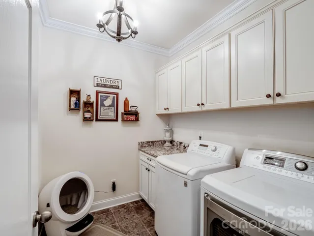 a view of storage and utility room with washer and dryer