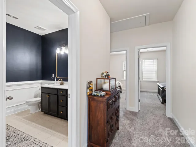 a spacious bathroom with a sink and mirror