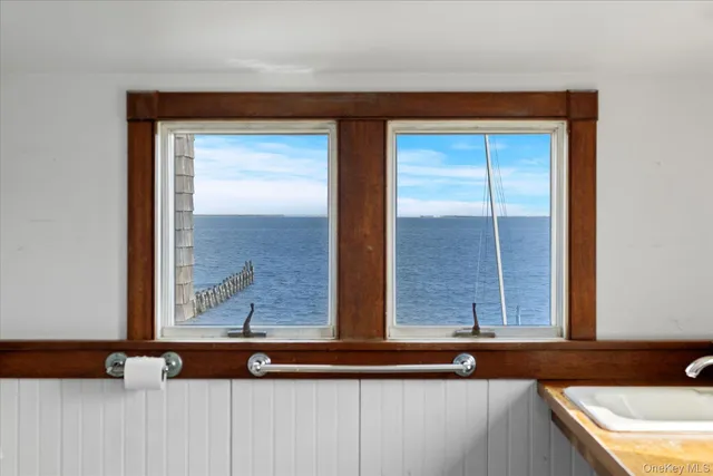 a bathroom with a sink vanity and a mirror