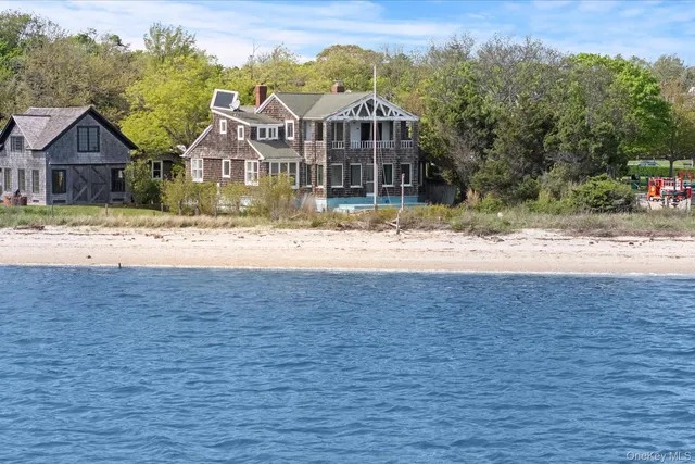 front view of a house next to a yard