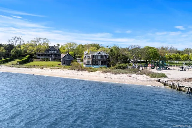 a view of swimming pool with outdoor seating and a garden