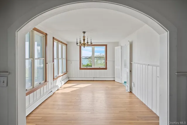 a view of a hallway with windows