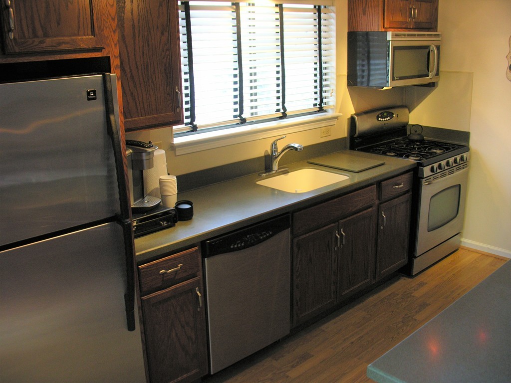78 Mountain Gate Road, Unit 78 Ashland, MA 01721 - Photo 4 of 17 a kitchen with a sink appliances and cabinets