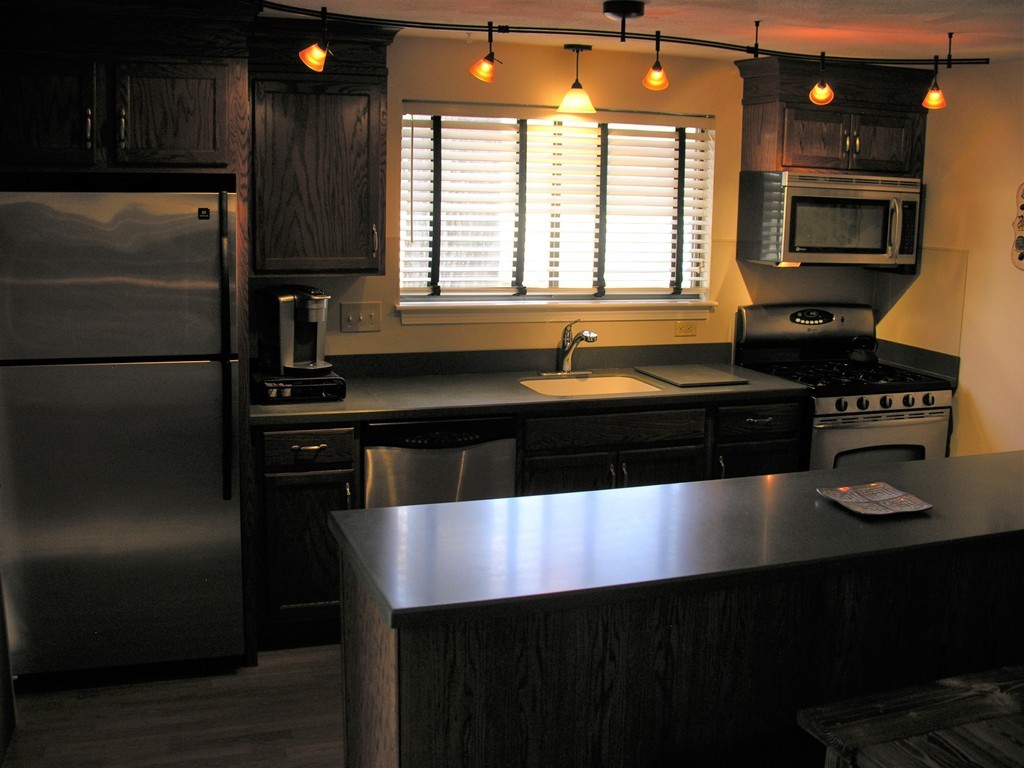 78 Mountain Gate Road, Unit 78 Ashland, MA 01721 - Photo 5 of 17 a kitchen with a refrigerator and a sink