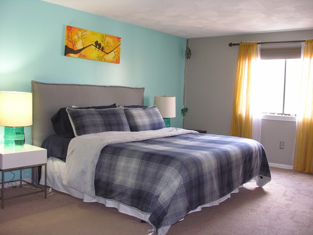 78 Mountain Gate Road, Unit 78 Ashland, MA 01721 - Photo 7 of 17 a bedroom with a bed and a window