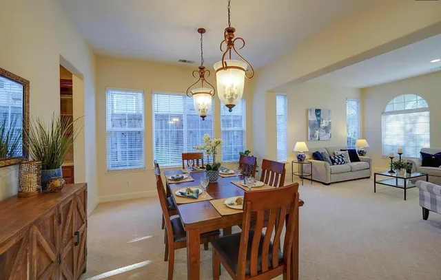 a view of a dining room with furniture window and outside view