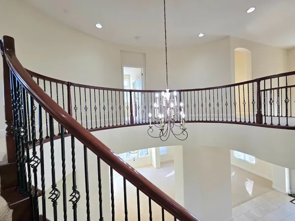 a view of staircase and door