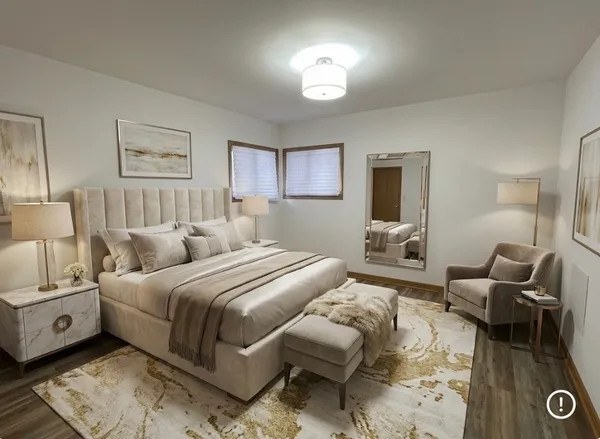 a spacious bedroom with a bed and furniture