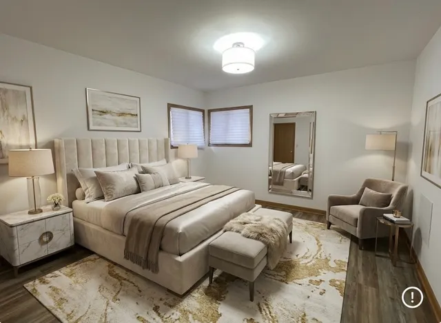 a spacious bedroom with a bed and furniture