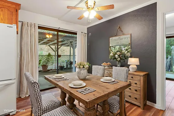 a view of a dining room with furniture window and outside view