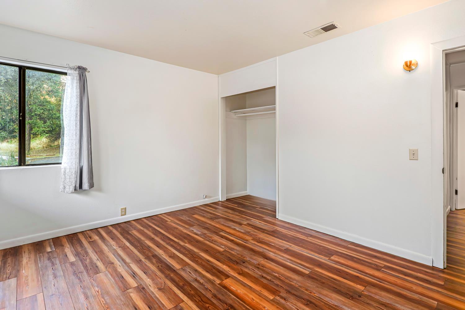 9174 State Rte 26 Mokelumne Hill, CA 95245 - Photo 19 of 52 a view of a room with wooden floor and window