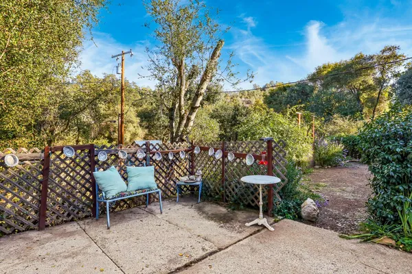 a view of a bench in a backyard