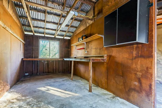 a view of a backyard with large trees