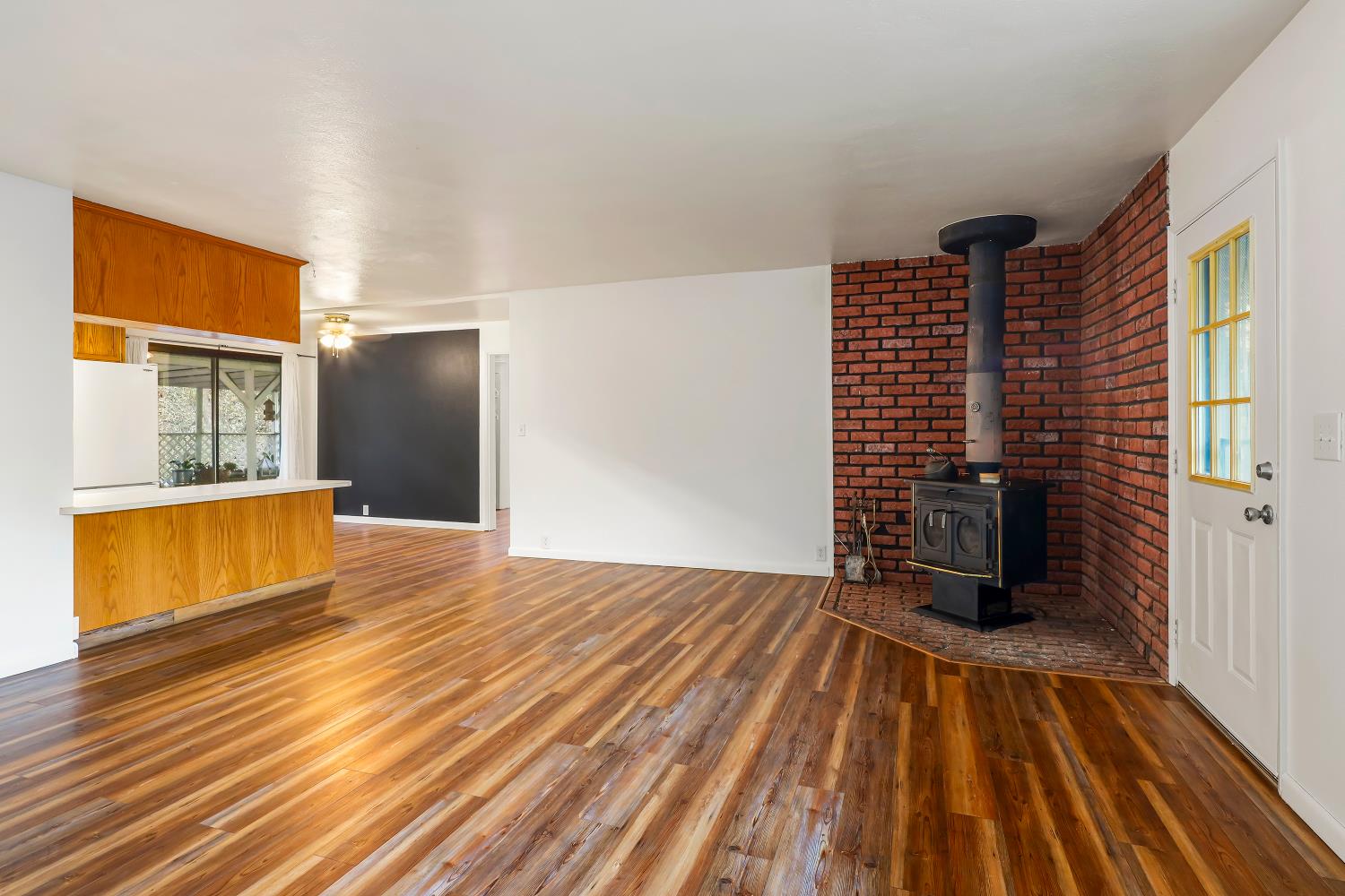 9174 State Rte 26 Mokelumne Hill, CA 95245 - Photo 5 of 52 a view of empty room with wooden floor and windows