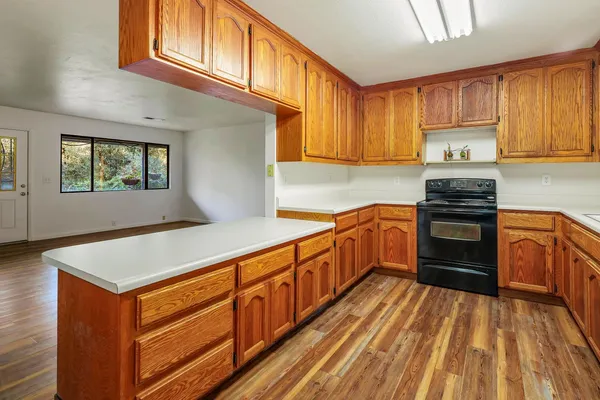 a kitchen with stainless steel appliances granite countertop a stove and a sink
