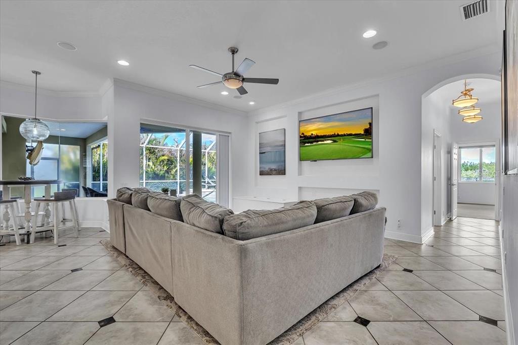 709 Country Meadows Way Bradenton, FL 34212 - Photo 14 of 97 a living room with furniture and a flat screen tv