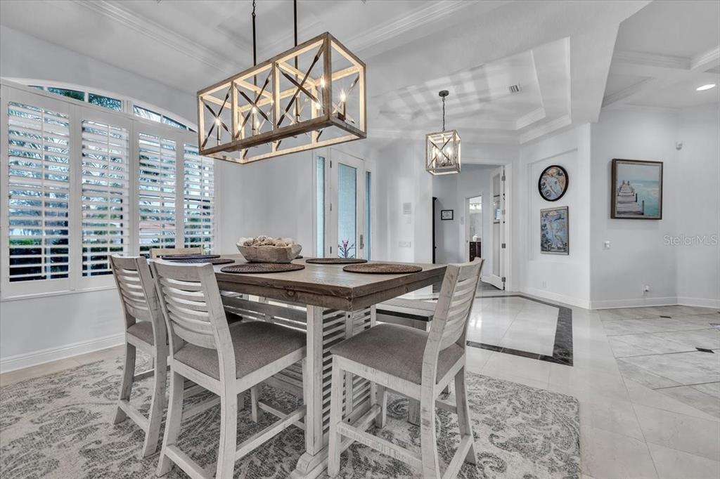 709 Country Meadows Way Bradenton, FL 34212 - Photo 35 of 97 a view of a table and chairs in a room