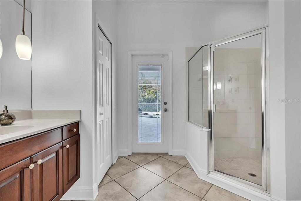709 Country Meadows Way Bradenton, FL 34212 - Photo 57 of 97 a bathroom with a shower sink and mirror
