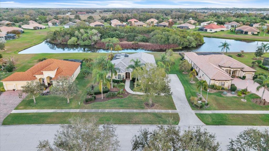 709 Country Meadows Way Bradenton, FL 34212 - Photo 86 of 97 an aerial view of residential houses with outdoor space and parking