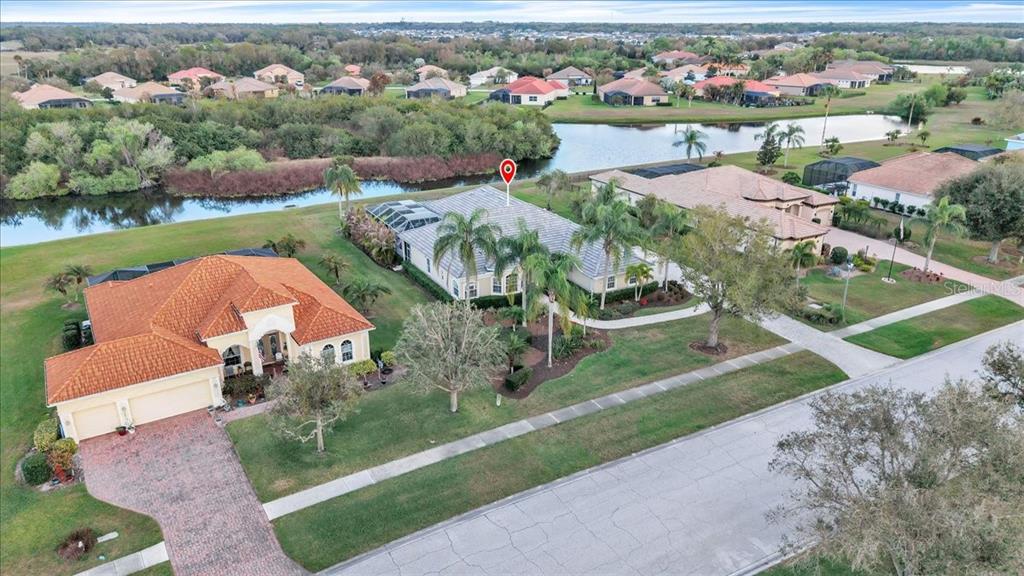 709 Country Meadows Way Bradenton, FL 34212 - Photo 87 of 97 an aerial view of a house with garden space and mountain view in back