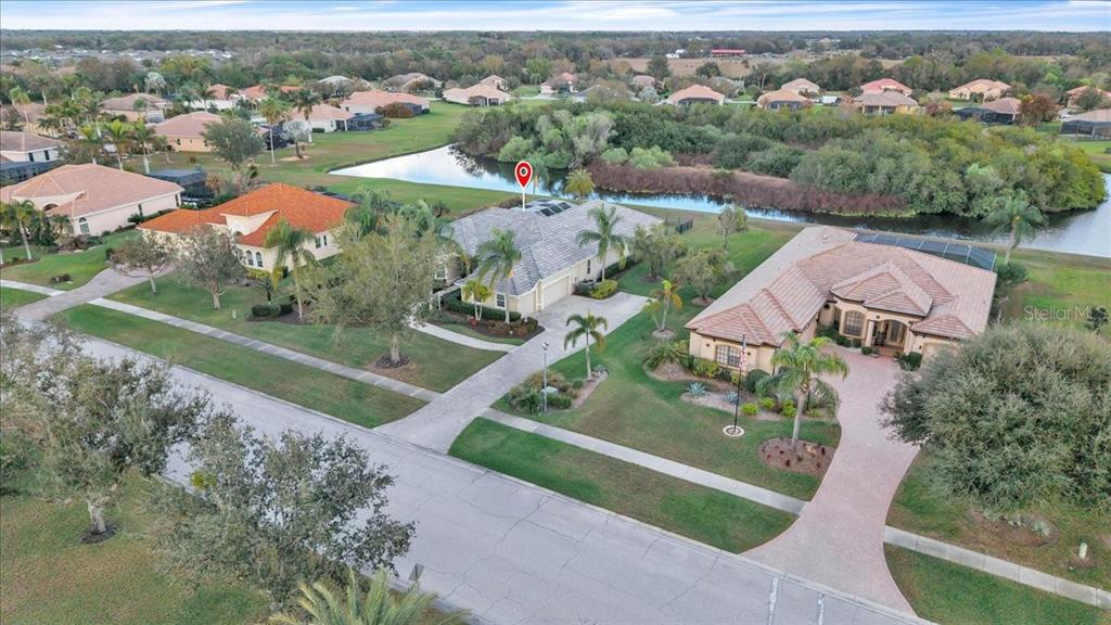 709 Country Meadows Way Bradenton, FL 34212 - Photo 88 of 97 an aerial view of residential houses with outdoor space and trees