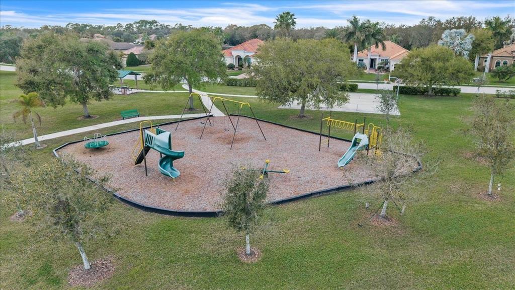 709 Country Meadows Way Bradenton, FL 34212 - Photo 96 of 97 an aerial view of a house with a yard